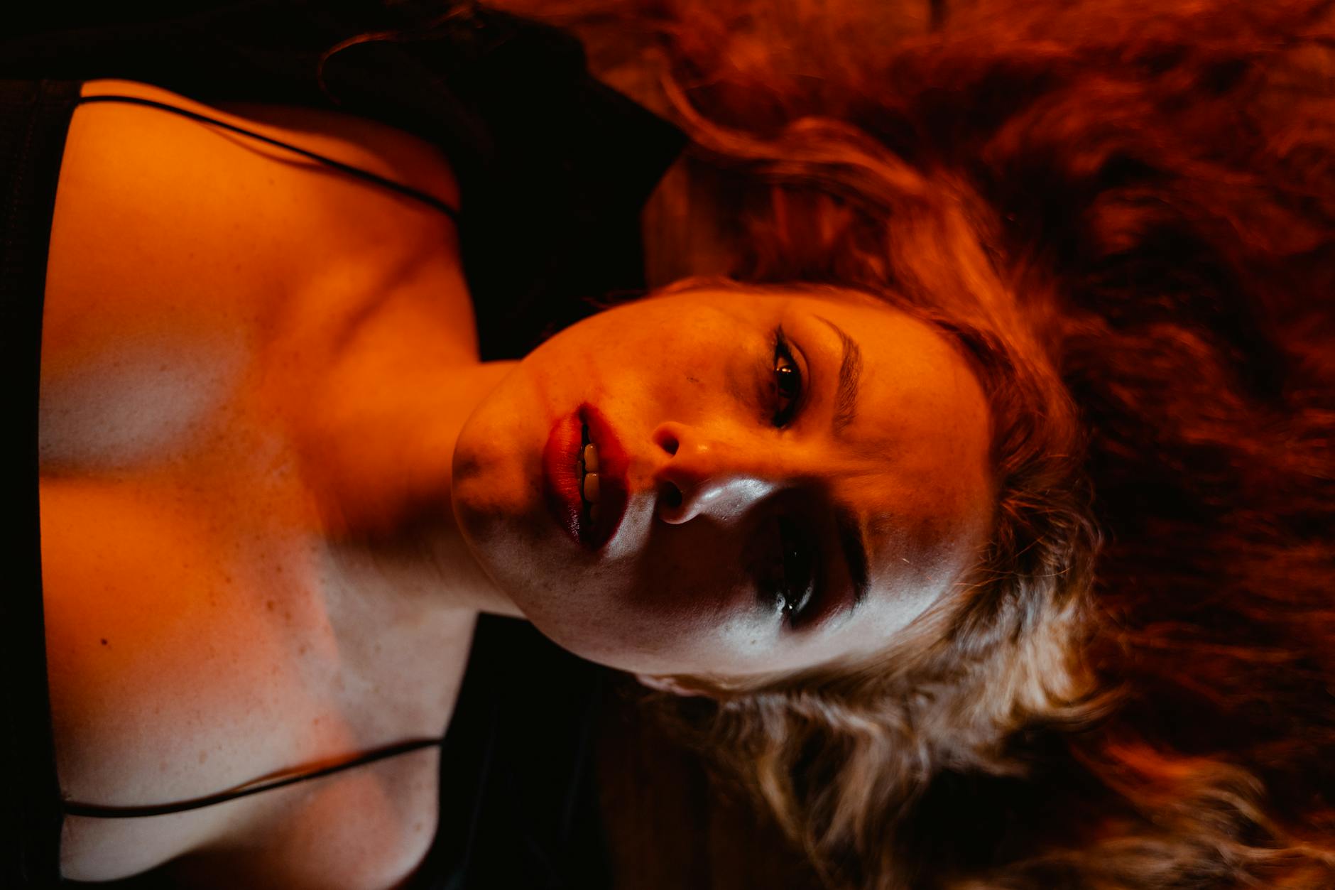 an emotional woman lying down